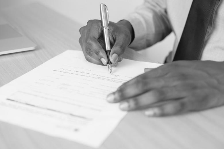 A person signing a contract